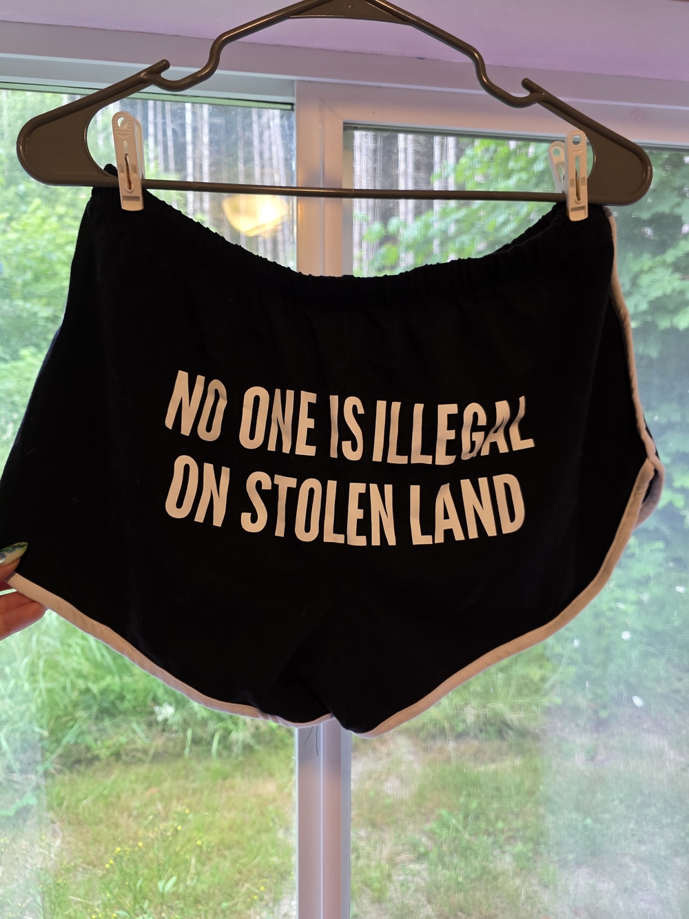 The Bummer Shop "No One Is Illegal On Stolen Land" Booty Shorts